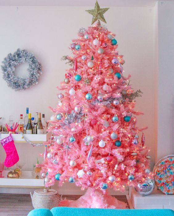 A Pink Flocked Christmas Tree with Teal Ornaments